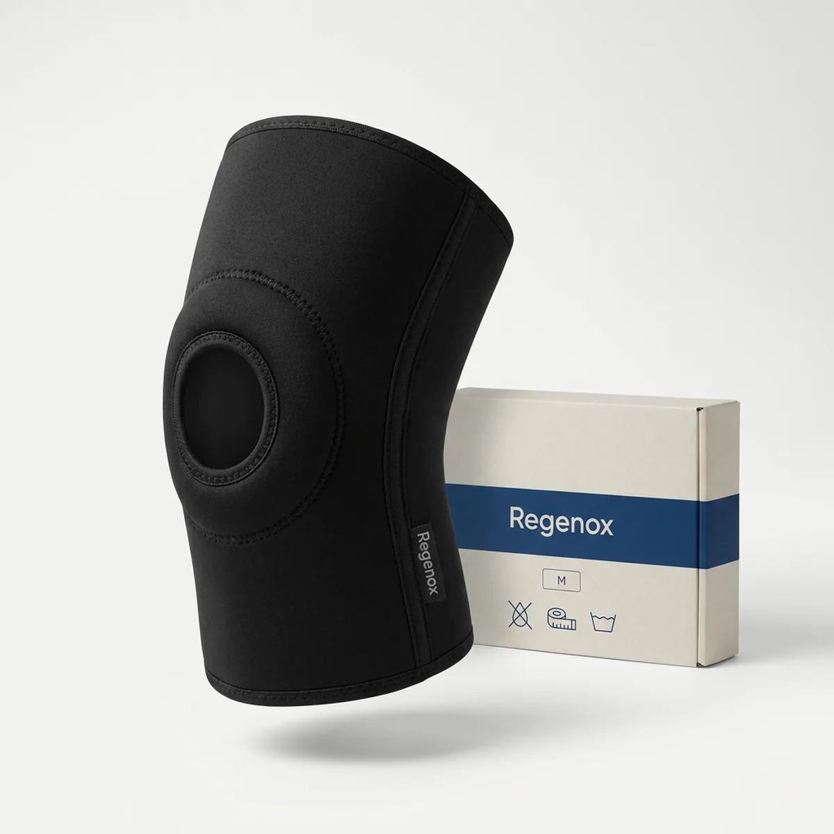 Single black Regenox open-patella knee sleeve standing upright, showing the round kneecap opening and stitched edge