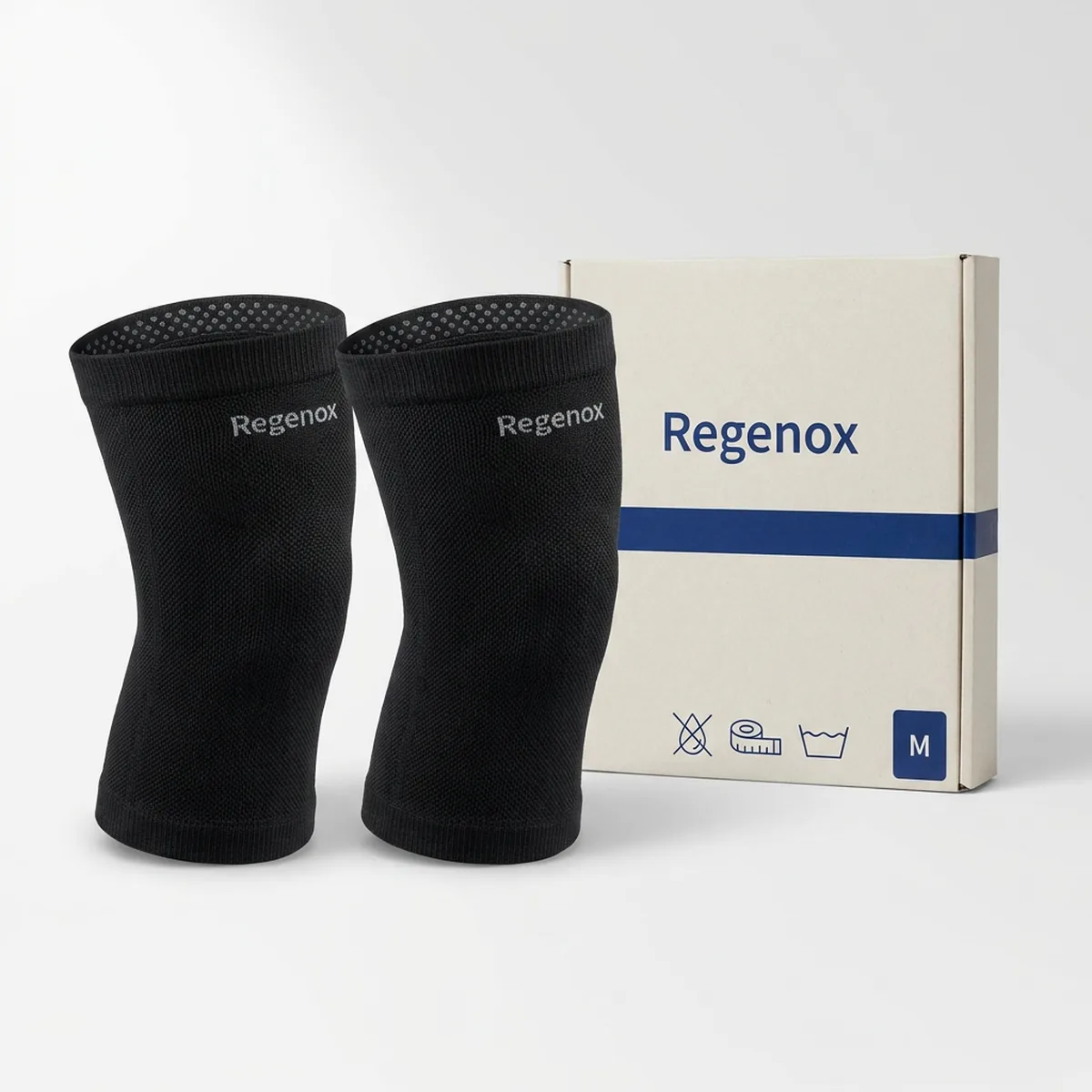 Two black Regenox knitted knee sleeves standing side by side with their kraft-white box