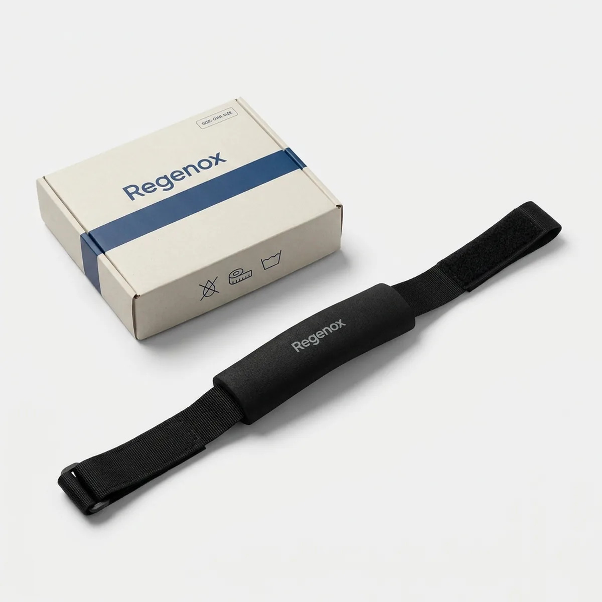 Black Regenox patella strap laid flat showing the padded tube and hook-and-loop closure